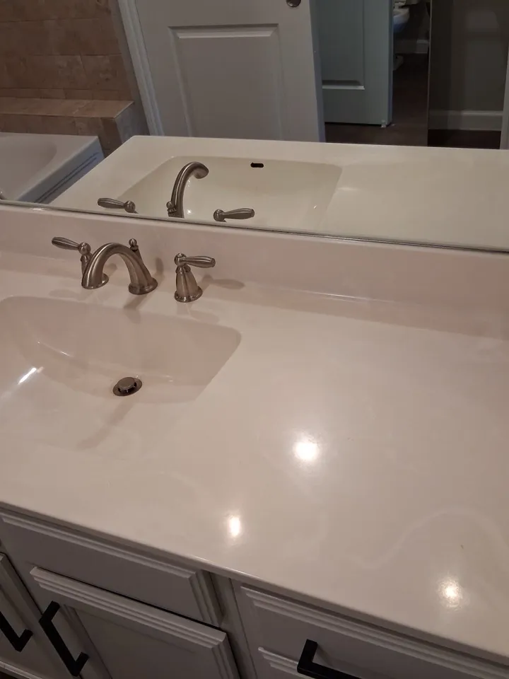 The same bathroom vanity wiped down and clear after a deep clean